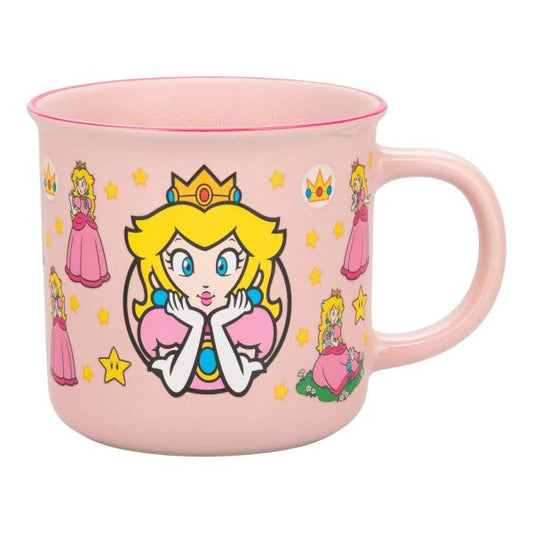 Princess-themed pink mug featuring playful designs of Princess Peach and colorful stars. Perfect for fans of Mario.